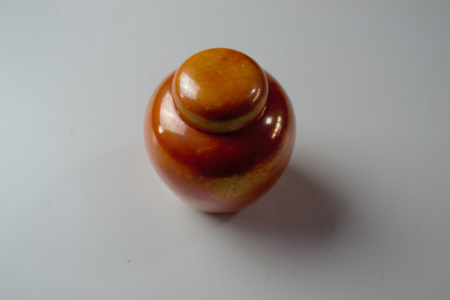 Ruskin Pottery Orange Lustre Ginger Jar.