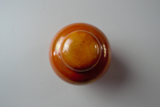 Ruskin Pottery Orange Lustre Ginger Jar.