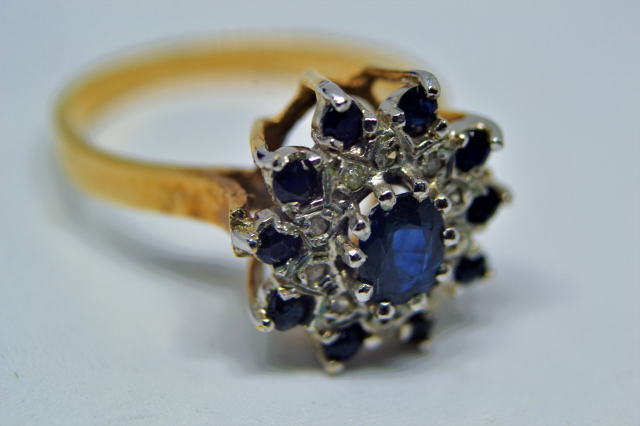 A 9ct Gold With Sapphire And Diamond  Cluster Ring.