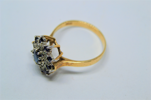 A 9ct Gold With Sapphire And Diamond  Cluster Ring.