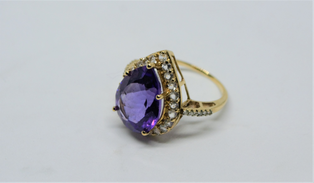 A 9ct Gold With Large Pear Cut Amethyst And CZ Ring.