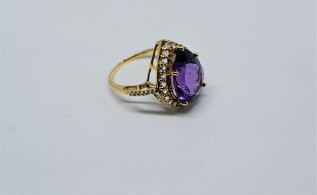A 9ct Gold With Large Pear Cut Amethyst And CZ Ring.