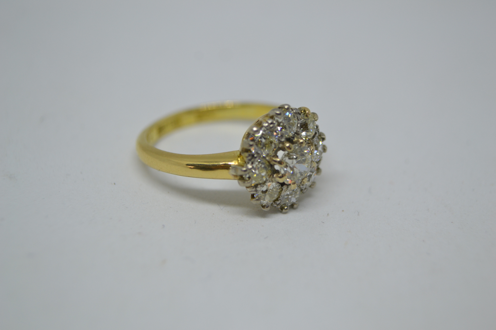 An 18 ct Gold  Diamond Flower Head Cluster Ring