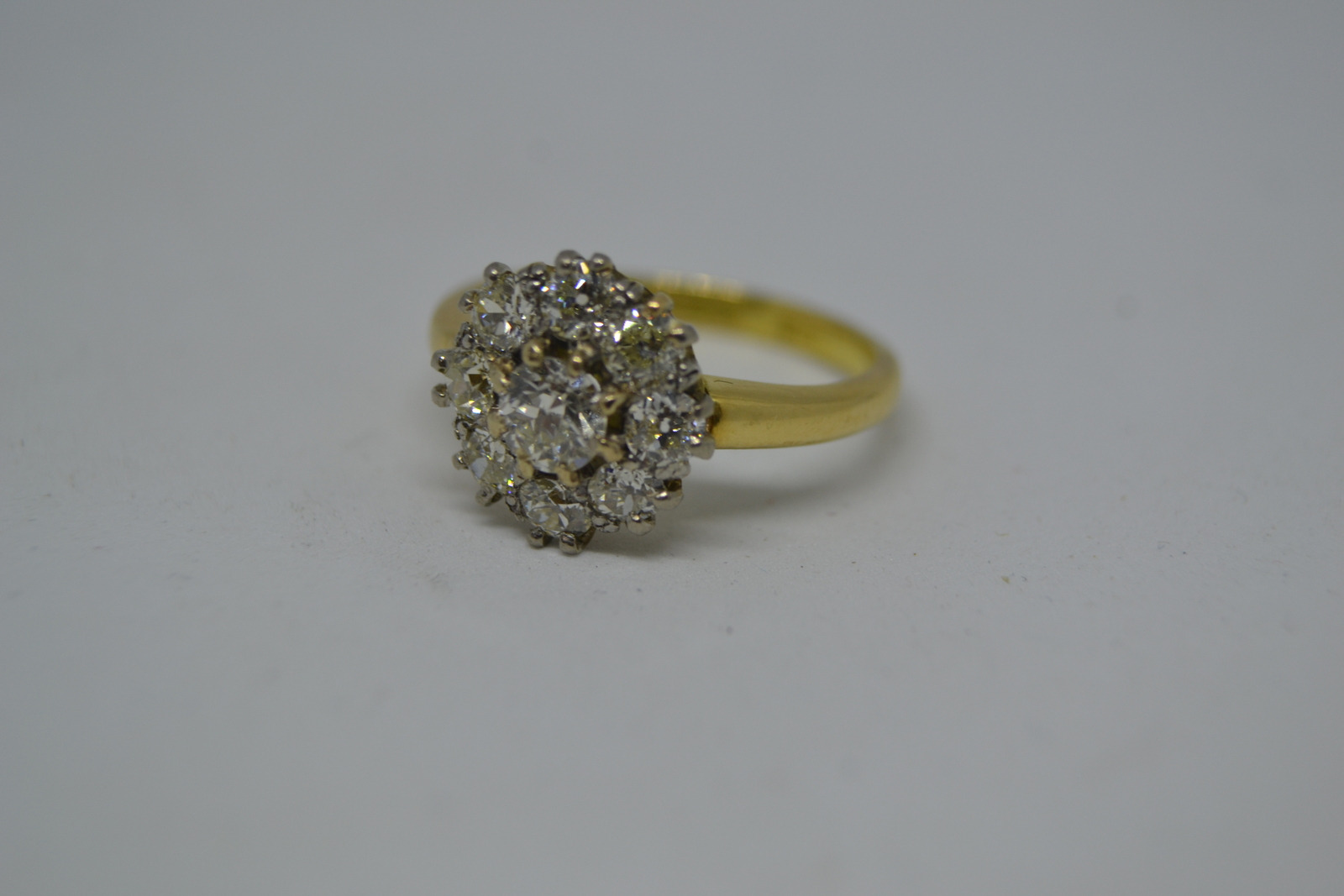 An 18 ct Gold  Diamond Flower Head Cluster Ring