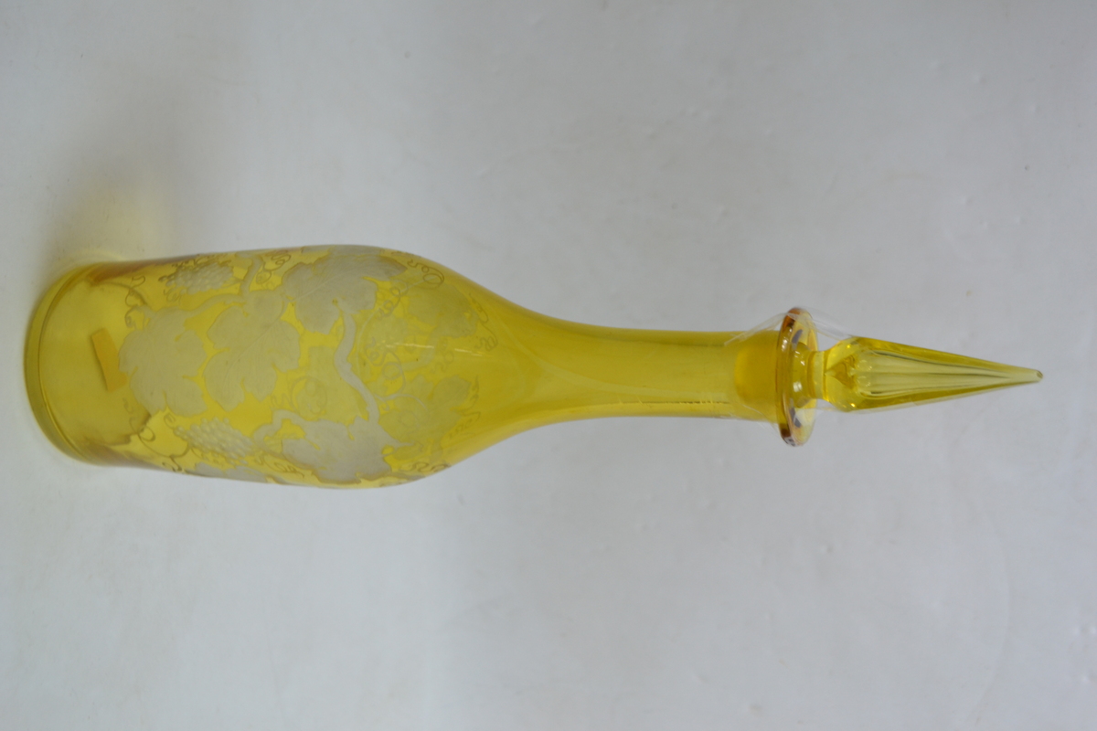 A 19th Century Continental Bottle Form Decanter Cased in Citron