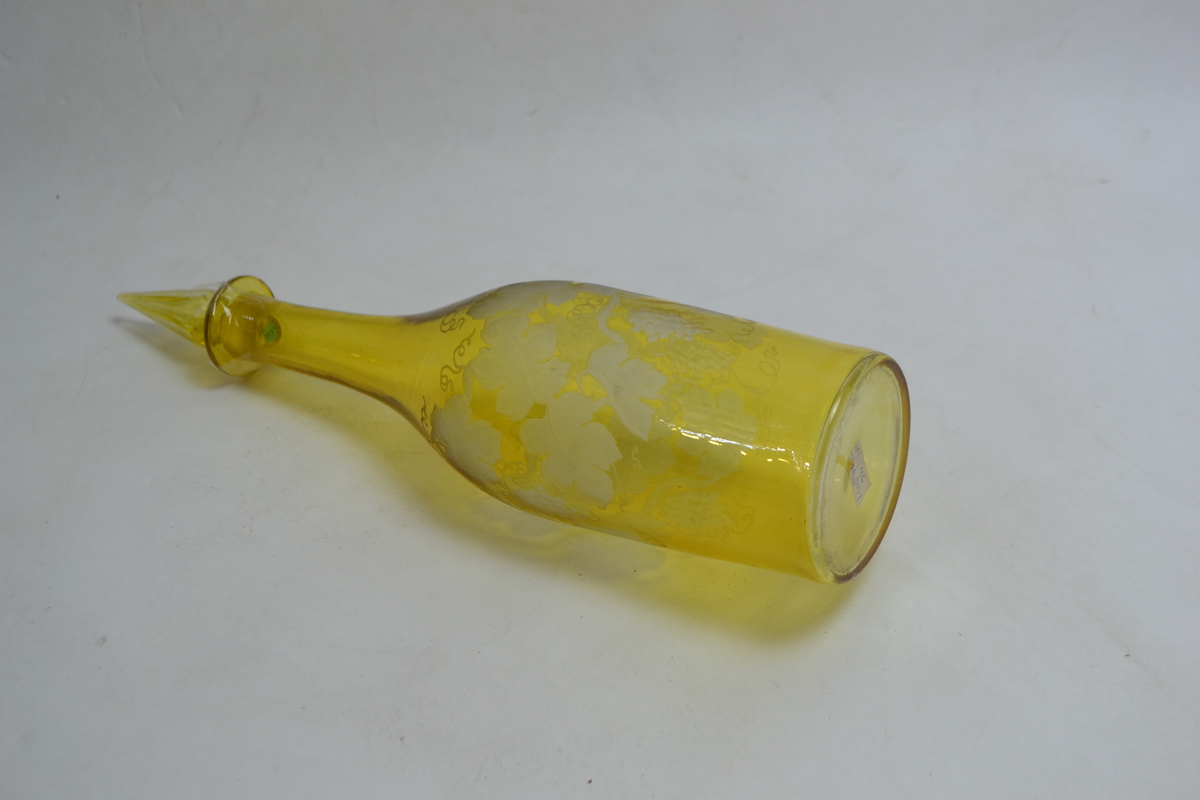 A 19th Century Continental Bottle Form Decanter Cased in Citron