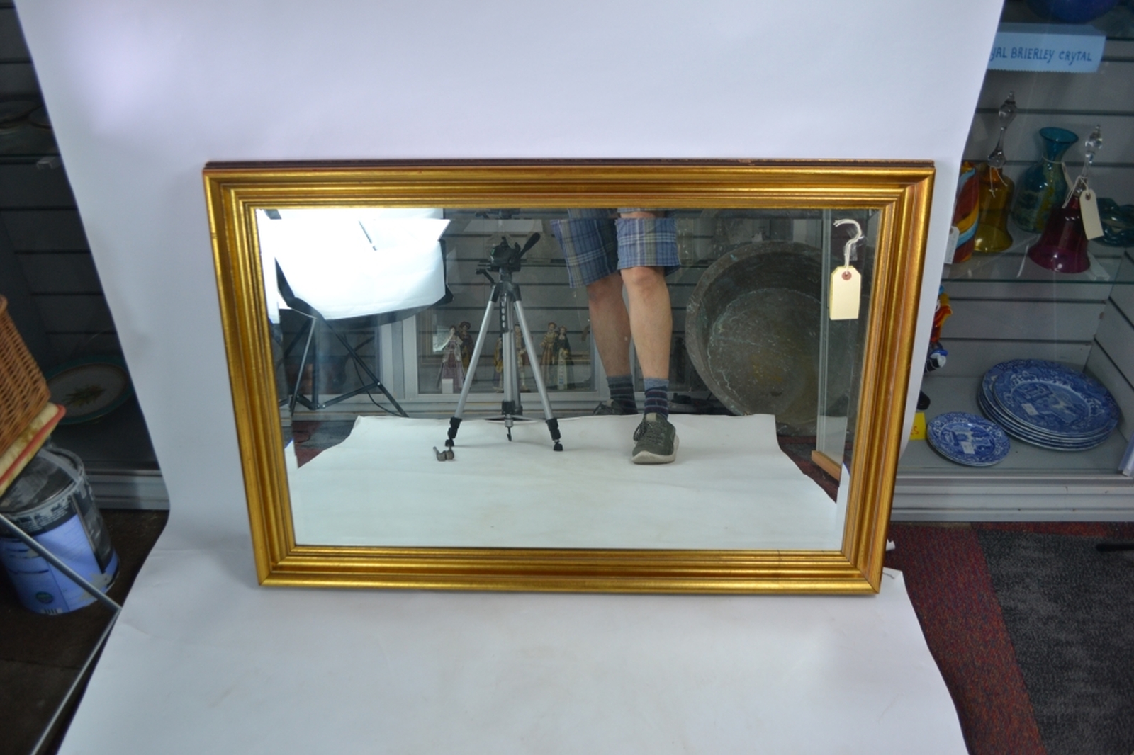 Gilt framed bevelled edge mirror.