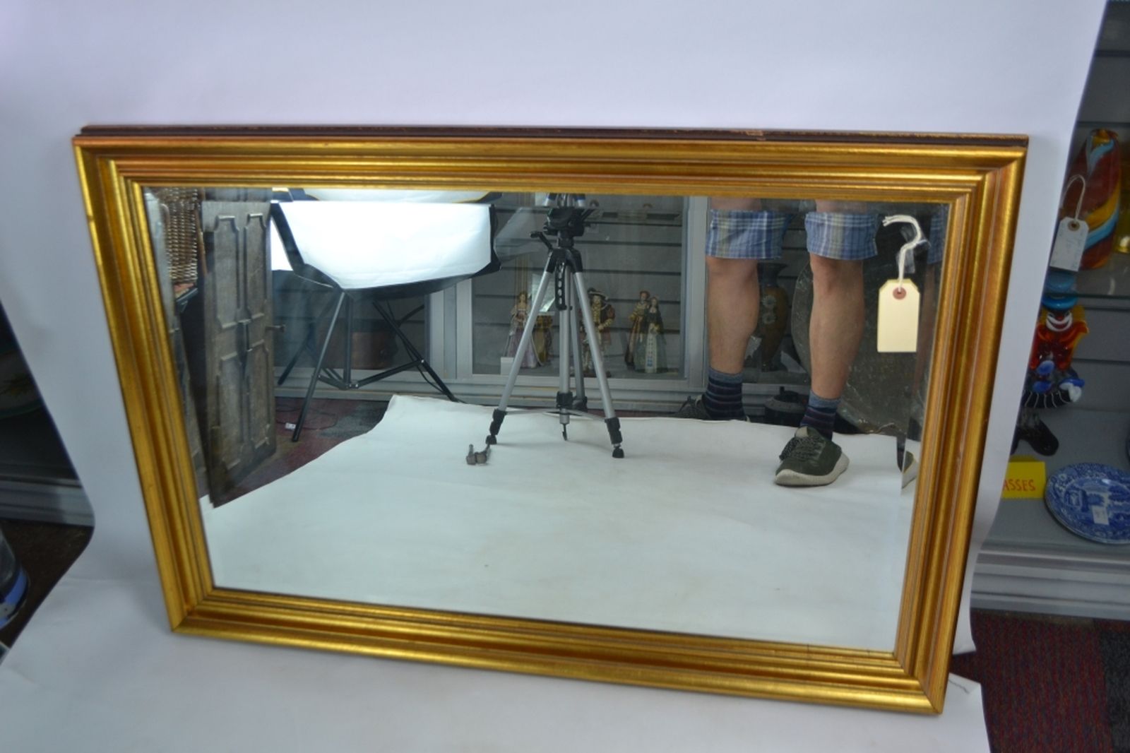 Gilt framed bevelled edge mirror.
