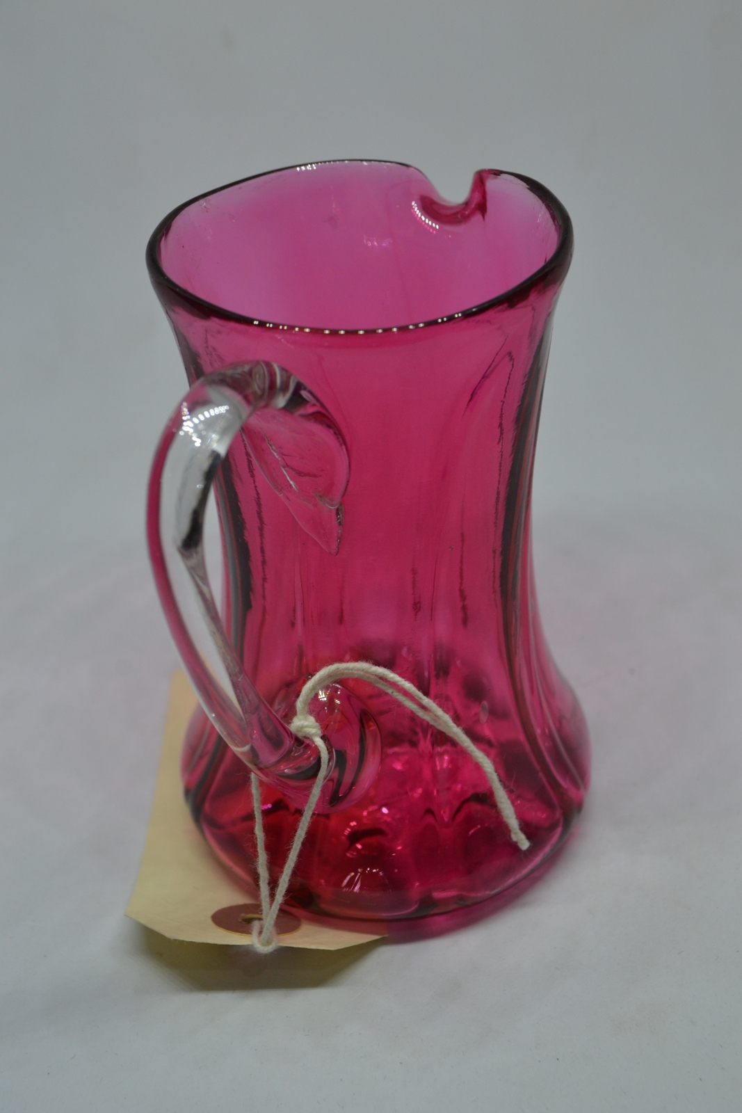 A Cranberry Milk Jug, c1860.