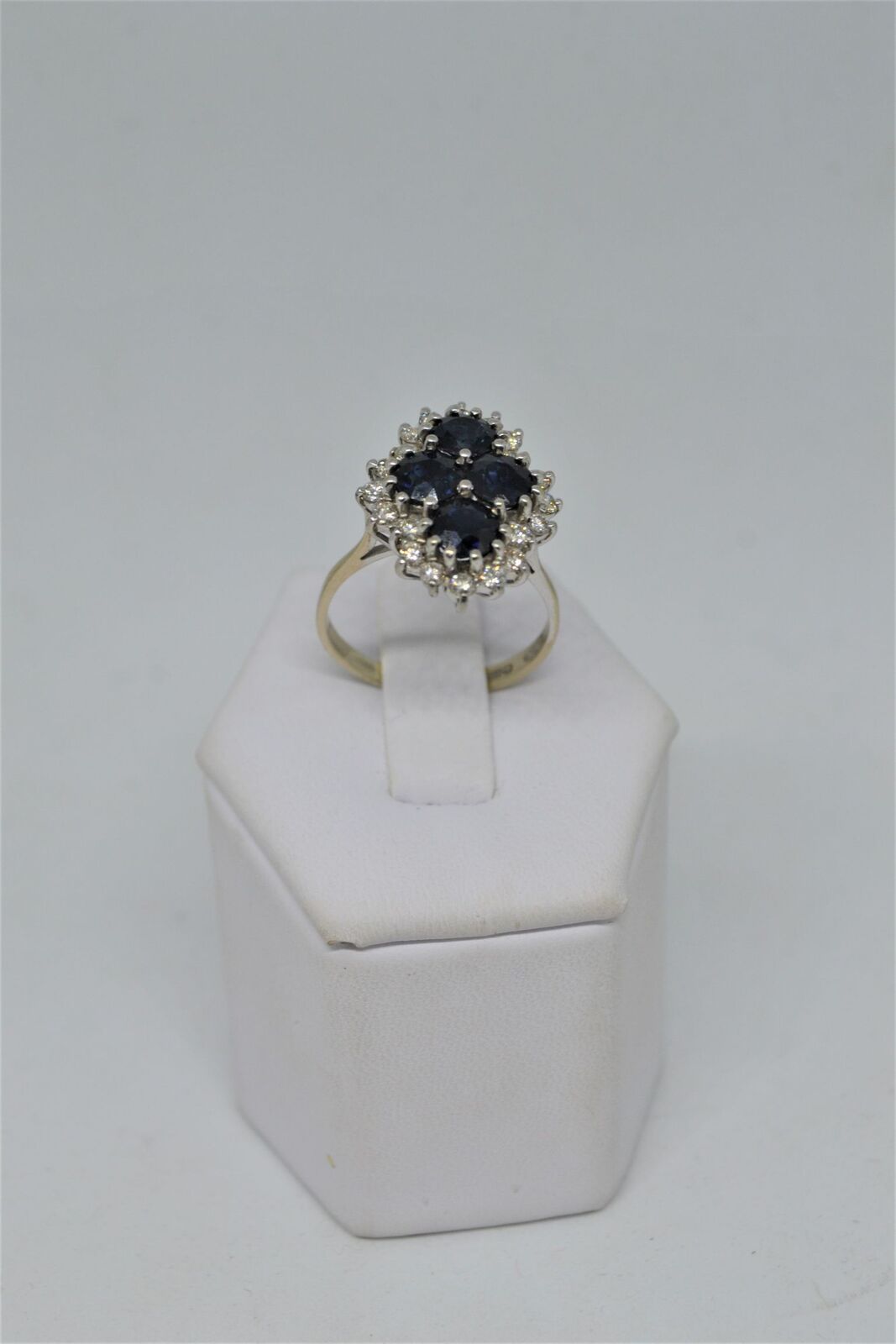 An 18ct white gold sapphire and diamond cluster ring