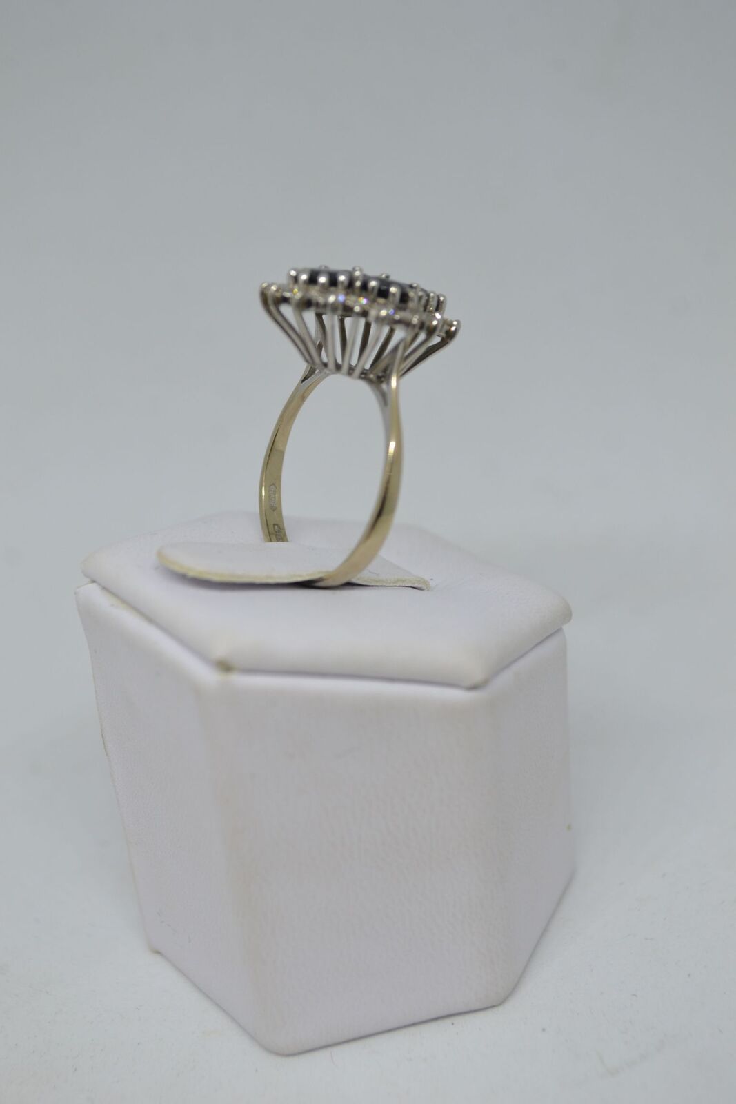 An 18ct white gold sapphire and diamond cluster ring