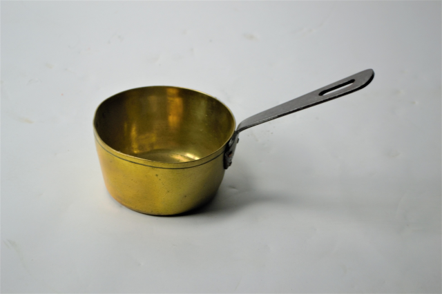 A Small Brass Pan With Long Handle